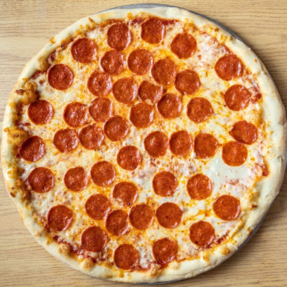 A large, round pepperoni pizza from Big John's Pizza & Pasta, with a golden crust and melted cheese.